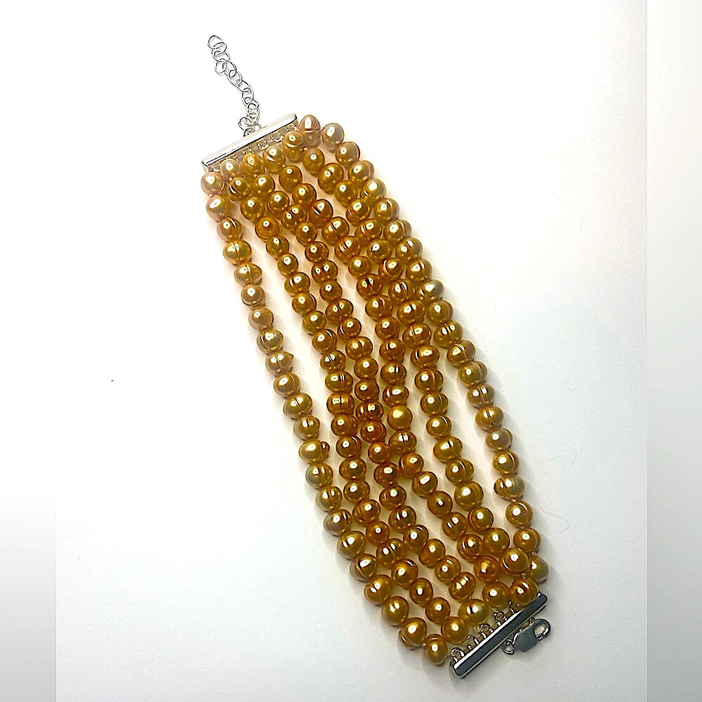 - Off brand cream brown pearl bracelet